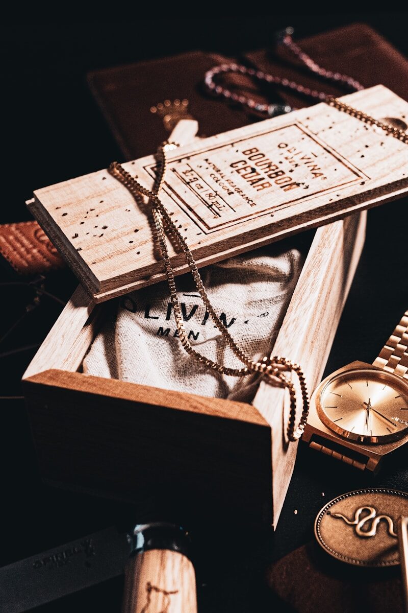 silver round analog watch on white paper